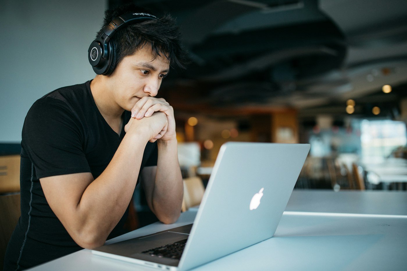 A student preparing notes for an online assessment